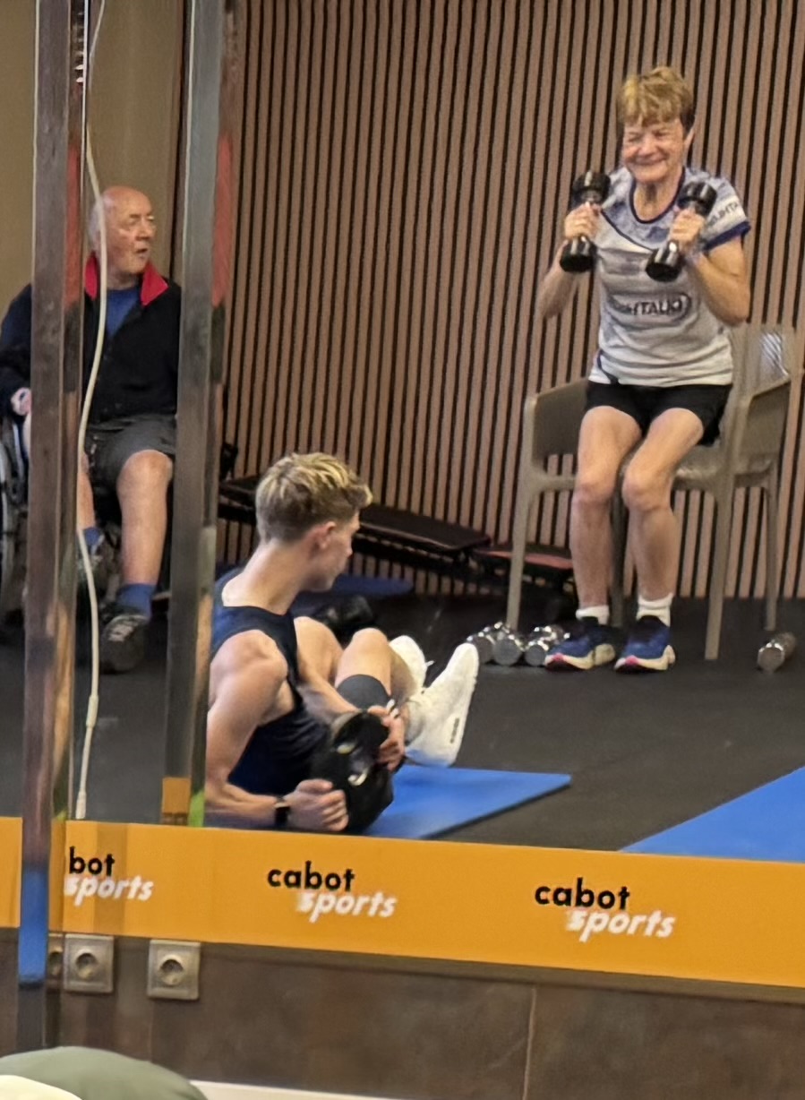 Reece training in the gym alongside Geoff and Yvonne